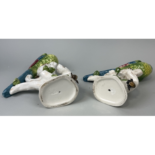 387 - A PAIR OF PAINTED PORCELAIN PARROTS
31cm H