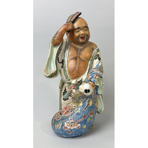 396 - A JAPANESE CERAMIC FIGURE WITH A CHILD
32cm H