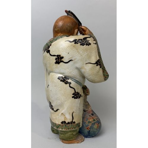 396 - A JAPANESE CERAMIC FIGURE WITH A CHILD
32cm H