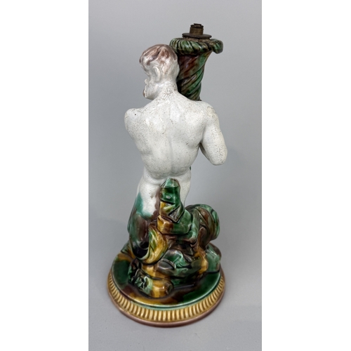 414 - A WEDGWOOD MAJOLICA TRITON CANDLESTICK
26cm H
Bonhams label to verso.