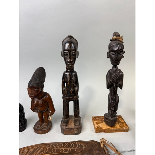 81 - A COLLECTION OF TRIBAL WOODEN FIGURES
To include:
Chambri Lakes, Papua New Guinea, label dating '193... 