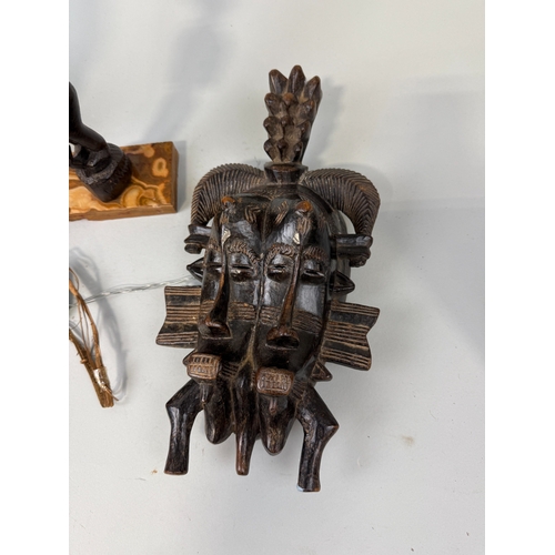 81 - A COLLECTION OF TRIBAL WOODEN FIGURES
To include:
Chambri Lakes, Papua New Guinea, label dating '193... 