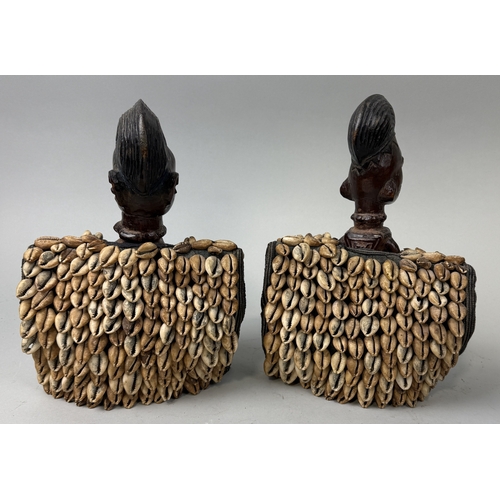 84 - A PAIR OF YORUBA IBEDJI TWIN FIGURES WITH CAORI SHELL COATS
28cm x 20cm
Provenance: Purchased from T... 