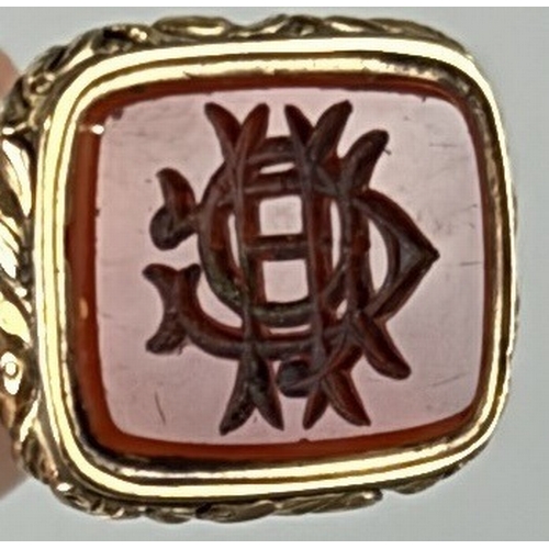 85 - A RED STONE FOB POSSIBLY CARNELIAN SET IN GILT METAL WITH METAL CHAIN
 