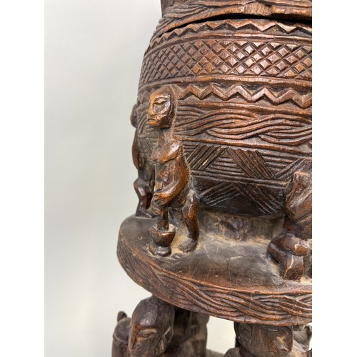 91 - A LARGE CARVED WOOD DOGON MALI CONTAINER
76cm H
Provenance: With handwritten label '1985...Bought in... 