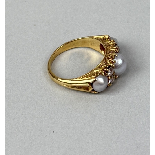 13 - AN ANTIQUE GOLD RING SET WITH THREE PEARLS AND FOUR DIAMONDS
Weight: 5.6gms