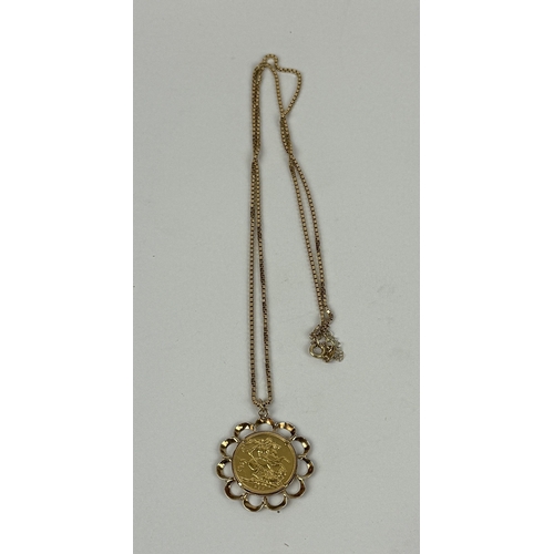 12 - A QUEEN ELIZABETH II 9CT GOLD HALF SOVEREIGN, IN 9CT GOLD MOUNT WITH 18CT GOLD CHAIN
Total weight: 1... 