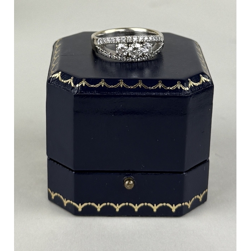 14 - AN 18CT WHITE GOLD SPLIT SHANK RING SET WITH THREE ROWS OF DIAMONDS, INCLUDING THREE LARGER CENTRAL ... 