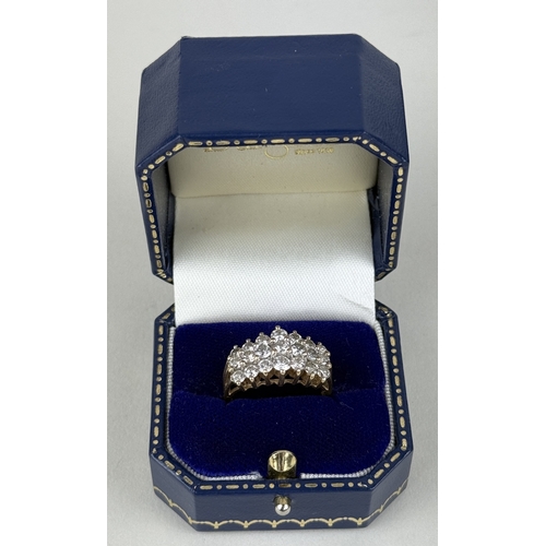 15 - A 9CT GOLD THREE ROW DIAMOND RING SET WITH 21 DIAMONDS
Weight: 4.1gms