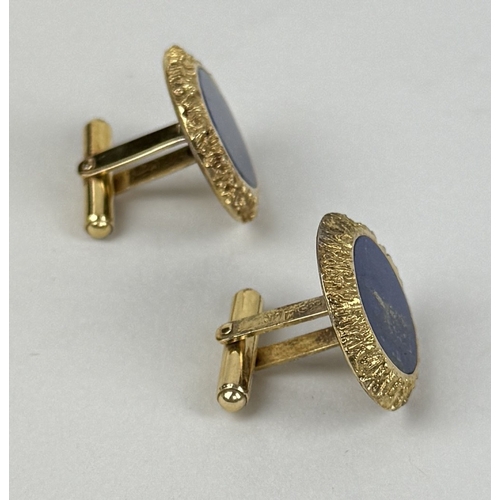 18 - A PAIR OF 14CT GOLD CUFFLINKS SET WITH LAPIS LAZULI
Total weight: 16.27gms
2.4cm D
Textured gold sur... 