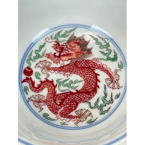2 - A CHINESE PORCELAIN DRAGON AND PHOENIX BOWL, KANGXI MARK AND OF THE PERIOD
The Imperial bowl painted... 