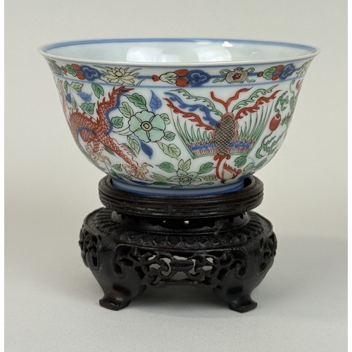 2 - A CHINESE PORCELAIN DRAGON AND PHOENIX BOWL, KANGXI MARK AND OF THE PERIOD
The Imperial bowl painted... 