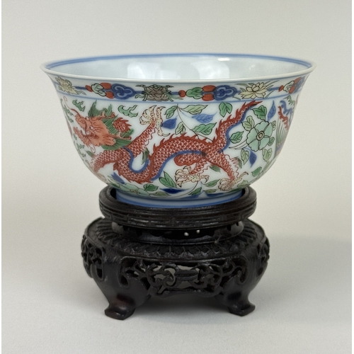 2 - A CHINESE PORCELAIN DRAGON AND PHOENIX BOWL, KANGXI MARK AND OF THE PERIOD
The Imperial bowl painted... 