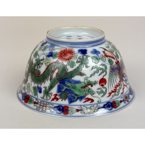 2 - A CHINESE PORCELAIN DRAGON AND PHOENIX BOWL, KANGXI MARK AND OF THE PERIOD
The Imperial bowl painted... 