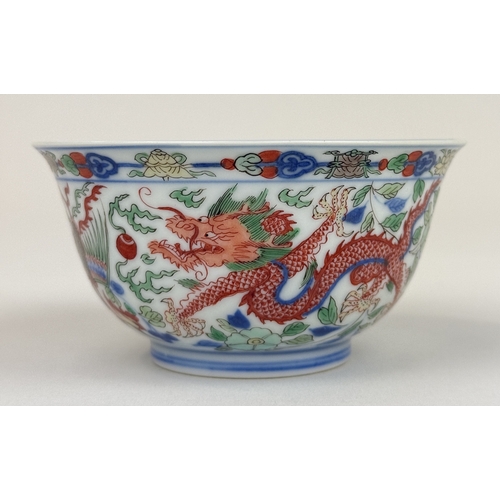 2 - A CHINESE PORCELAIN DRAGON AND PHOENIX BOWL, KANGXI MARK AND OF THE PERIOD
The Imperial bowl painted... 