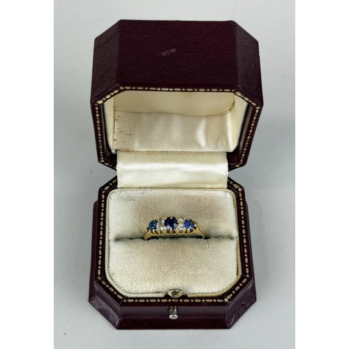 22 - AN 18CT GOLD SEVEN STONE RING SET WITH SAPPHIRES AND DIAMONDS
Weight: 4.09gms