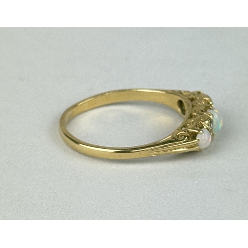 26 - AN 18CT GOLD SEVEN STONE OPAL AND DIAMOND RING
Total weight: 4.2gms