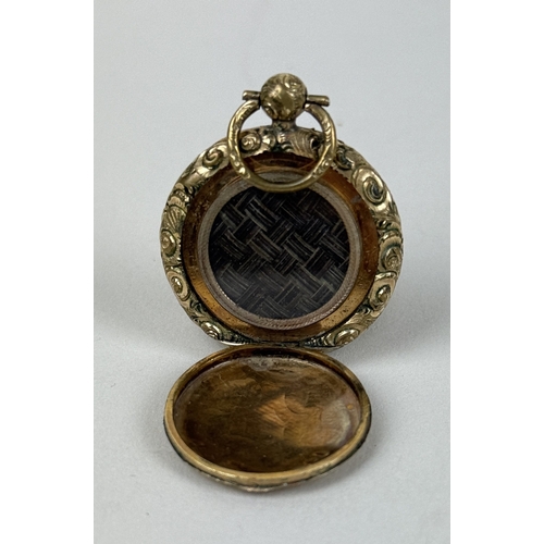28 - AN ANTIQUE GOLD LOCKET WITH WOVEN HAIR, OPENS BOTH SIDES
3cm D
Weight: 14.6gms