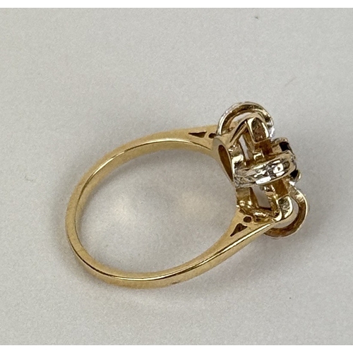36 - A 14CT GOLD RING WITH RUBY IN CENTRE WITH DIAMONDS AND TOPAZ SURROUNDING