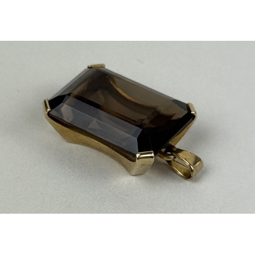 39 - AN EMERALD CUT SMOKY QUARTZ PENDANT IN 9CT GOLD
Weight: 7.5gms