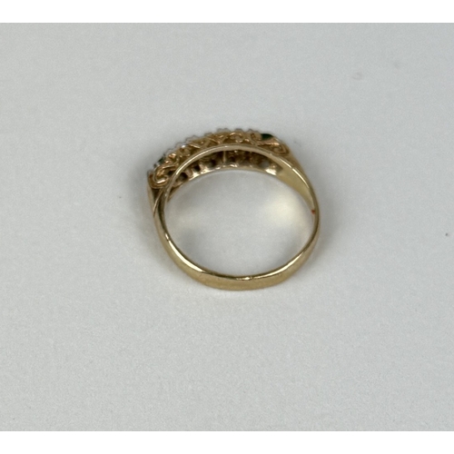43 - A 9CT GOLD RING SET WITH DIAMONDS AND GREEN STONES POSSIBLY EMERALDS
3.04gms