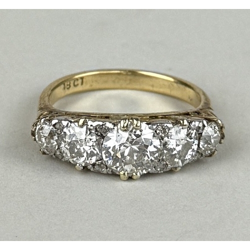 8 - AN 18CT GOLD FIVE STONE DIAMOND RING, CENTRAL DIAMOND 1.06CT
 
One central old European cut diamond,... 