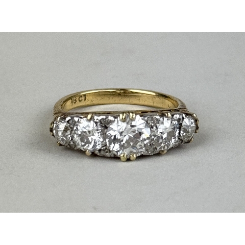 8 - AN 18CT GOLD FIVE STONE DIAMOND RING, CENTRAL DIAMOND 1.06CT
 
One central old European cut diamond,... 