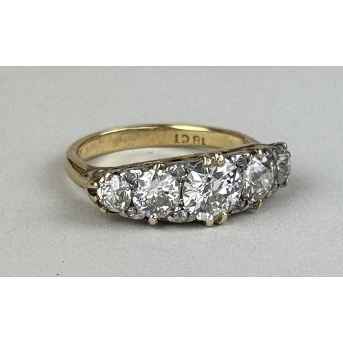8 - AN 18CT GOLD FIVE STONE DIAMOND RING, CENTRAL DIAMOND 1.06CT
 
One central old European cut diamond,... 