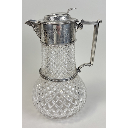 120 - A EDWARD HUTTON .925 STERLING SILVER AND CUT GLASS CLARET JUG, 1892
Height: 24cm