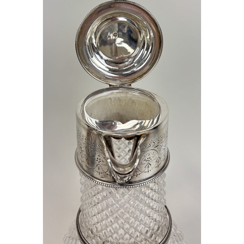 120 - A EDWARD HUTTON .925 STERLING SILVER AND CUT GLASS CLARET JUG, 1892
Height: 24cm
