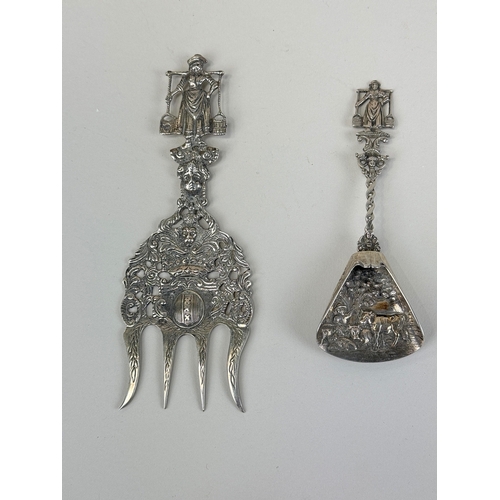 132 - AN ANTIQUE SILVER CADDY SPOON TOGETHER WITH A COMB, PROBABLY DUTCH TOGETHER WITH TWO LONG SPOONS
Tot... 