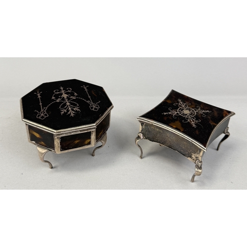 136 - TWO ANTIQUE TORTOISESHELL AND SILVER BOXES, EACH RAISED ON FOUR LEGS
Largest 10cm x 6.5cm... 