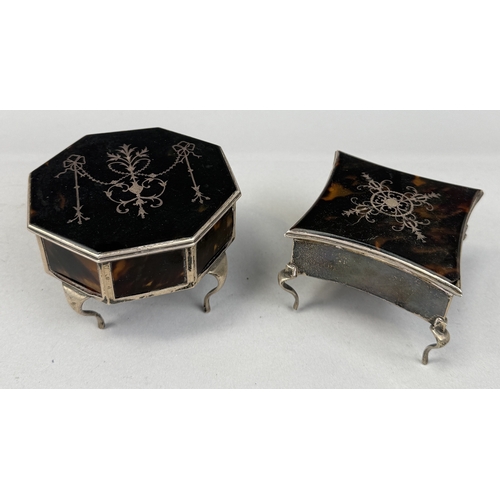 136 - TWO ANTIQUE TORTOISESHELL AND SILVER BOXES, EACH RAISED ON FOUR LEGS
Largest 10cm x 6.5cm... 