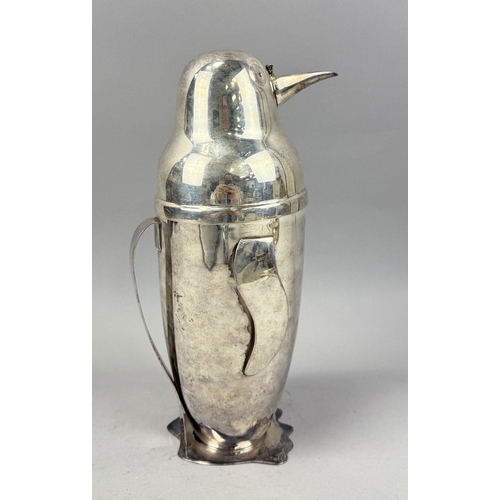 139 - A SILVER PLATED NOVELTY COCKTAIL SHAKER IN THE FORM OF A PENGUIN
31cm H
Part of beak missing.
 ... 