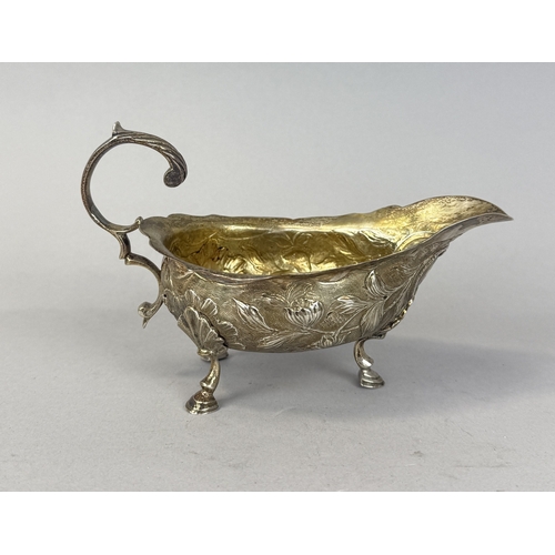 143 - A GEORGIAN SILVER SAUCE BOAT WITH FLORAL REPOUSSE DESIGN
Weight: 115gms
14cm x 9cm... 