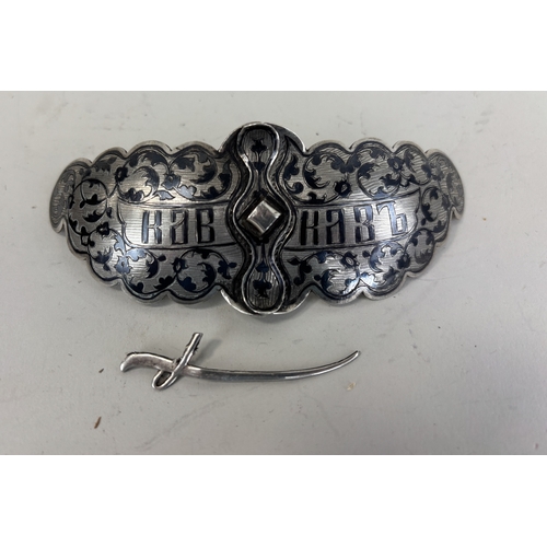 154 - A RUSSIAN SILVER BELT BUCKLE WITH SWORD AND NIELLO DETAILING
31gms