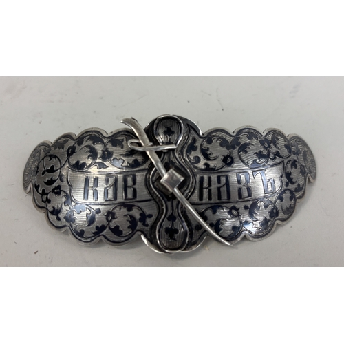 154 - A RUSSIAN SILVER BELT BUCKLE WITH SWORD AND NIELLO DETAILING
31gms