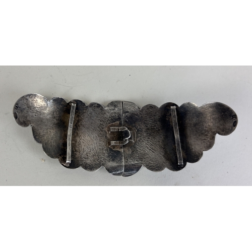 154 - A RUSSIAN SILVER BELT BUCKLE WITH SWORD AND NIELLO DETAILING
31gms