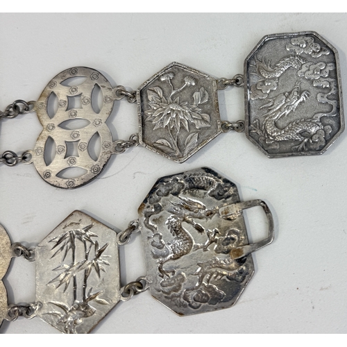 159 - A CHINESE SILVER BELT
Weight: 137gms
81cm L