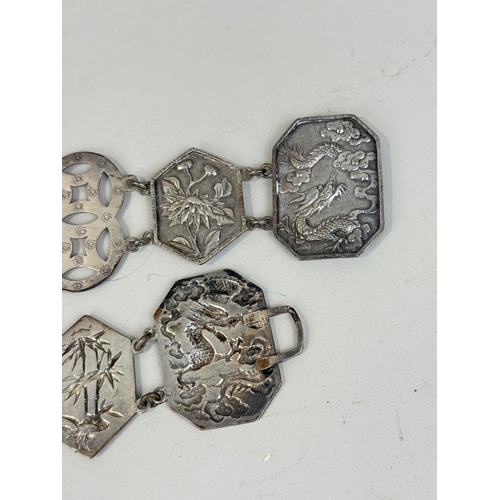 159 - A CHINESE SILVER BELT
Weight: 137gms
81cm L