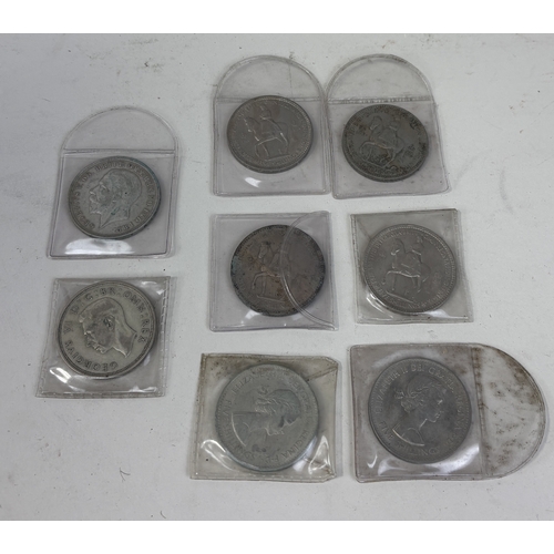 160 - A GROUP OF 20TH CENTURY SILVER CROWNS, TO INCLUDE GEORGE V, GEORGE VI AND SIX ELIZABETH II
In protec... 