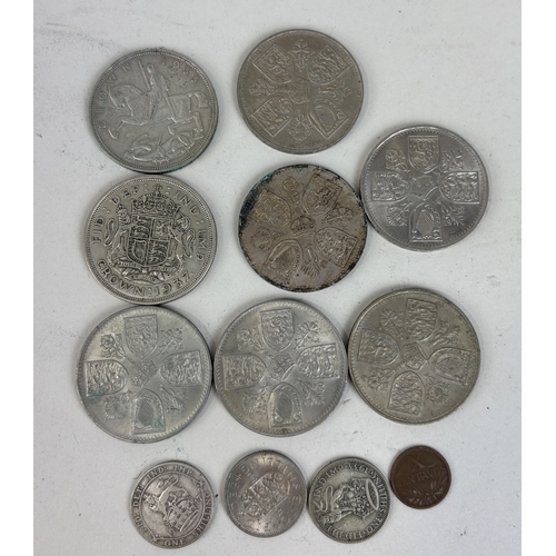 160 - A GROUP OF 20TH CENTURY SILVER CROWNS, TO INCLUDE GEORGE V, GEORGE VI AND SIX ELIZABETH II
In protec... 