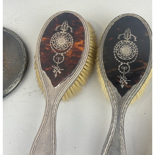 173 - SILVER AND TORTOISESHELL VANITY BRUSHES TOGETHER WITH A SILVER VANITY MIRROR
Largest 27cm L... 