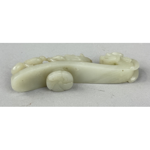 249 - A 19TH CENTURY CHINESE JADE DRAGON BELT HOOK
10cm L