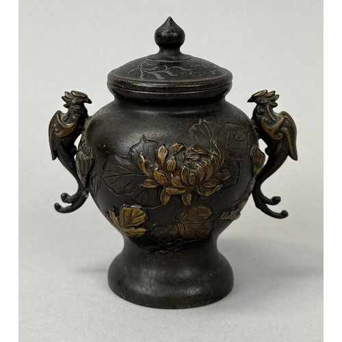 259 - A JAPANESE METAL VASE AND COVER WITH TWIN PHOENIX HANDLES
9.5cm H
 