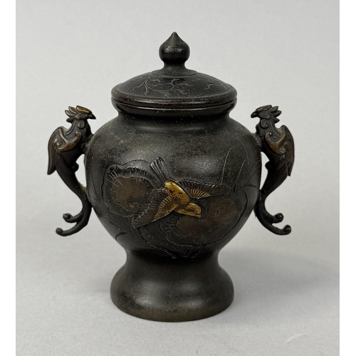 259 - A JAPANESE METAL VASE AND COVER WITH TWIN PHOENIX HANDLES
9.5cm H
 