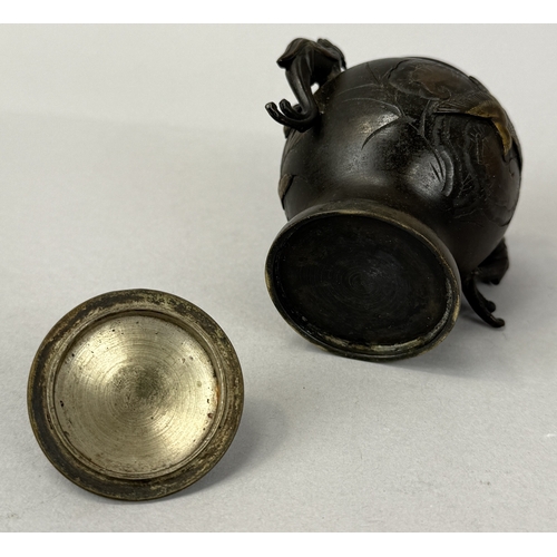 259 - A JAPANESE METAL VASE AND COVER WITH TWIN PHOENIX HANDLES
9.5cm H
 