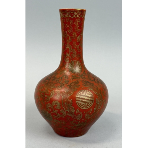 265 - A CHINESE BOTTLE VASE CORAL RED WITH GILT DETAILING
Qiang Long mark