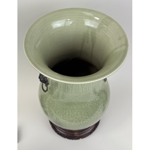 272 - A CHINESE KANGXI STYLE CELADON ZUN VASE
34cm H
Rosewood stand.