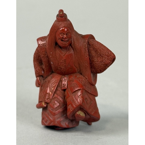 272A - A JAPANESE RED LACQUERED NETSUKE DEPICTING A FIGURE, SIGNED TO BASE
5.8cm H